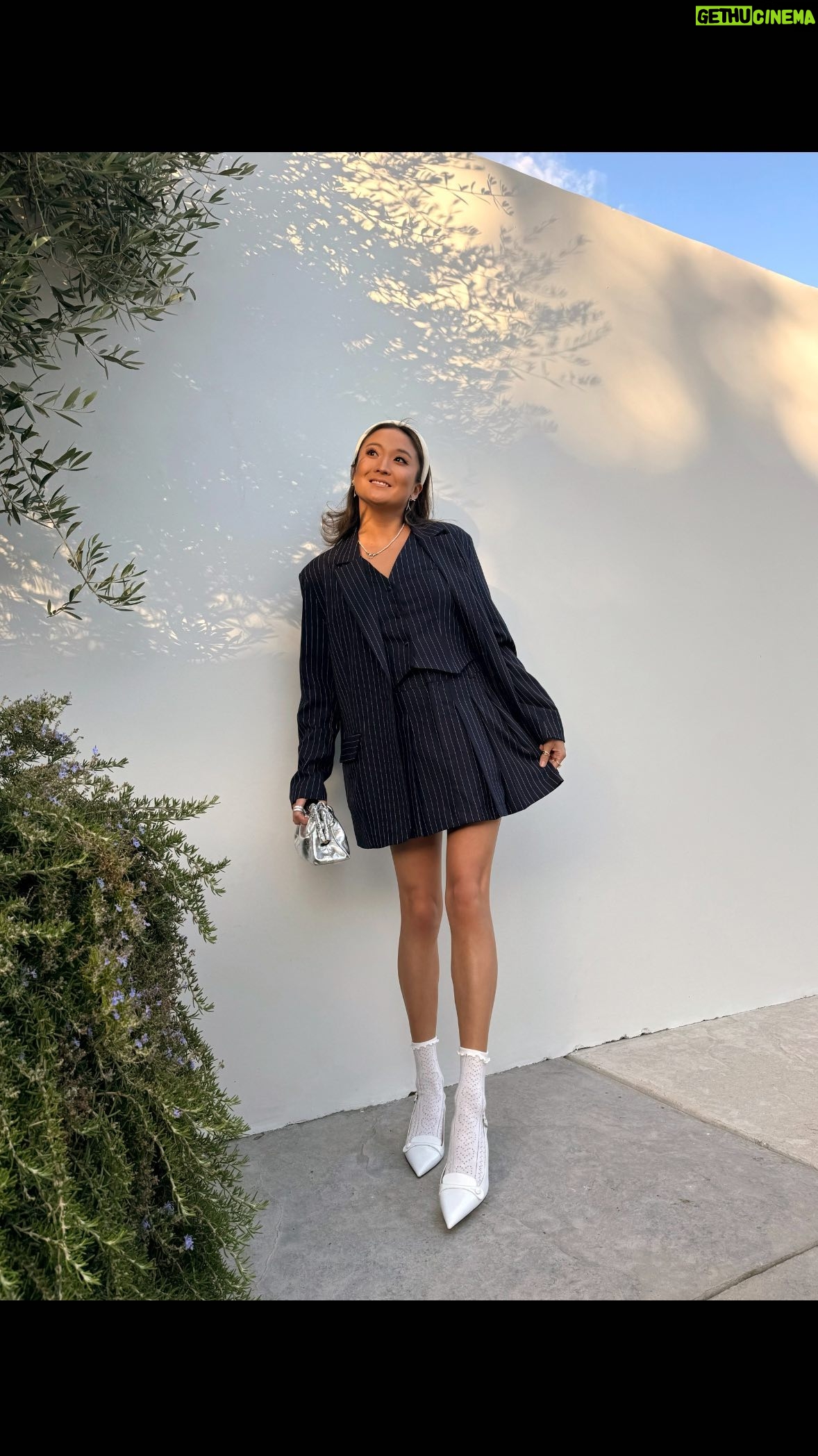 Ashley Park Instagram - pinstripes pieces for anytime & anywhere 🤗 which of these styles from my latest @renttherunway collection is your fave? filmed this a few months back in LA and you best believe the pinstripes have been packed in Paris too! link in my bio to rent this NEW collection, only on renttherunway.com - and use code ASHLEY30 to get 30% off your first month of RTR’s 10-item plan! #AshleyParkxRTR #RTRpartner