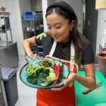 Ashley Park Instagram - cooking class in Thailand was wow, so who wants to try my ‘park thai’?? (Swipe for 👩🏻‍🍳) happy holidays kaaaa