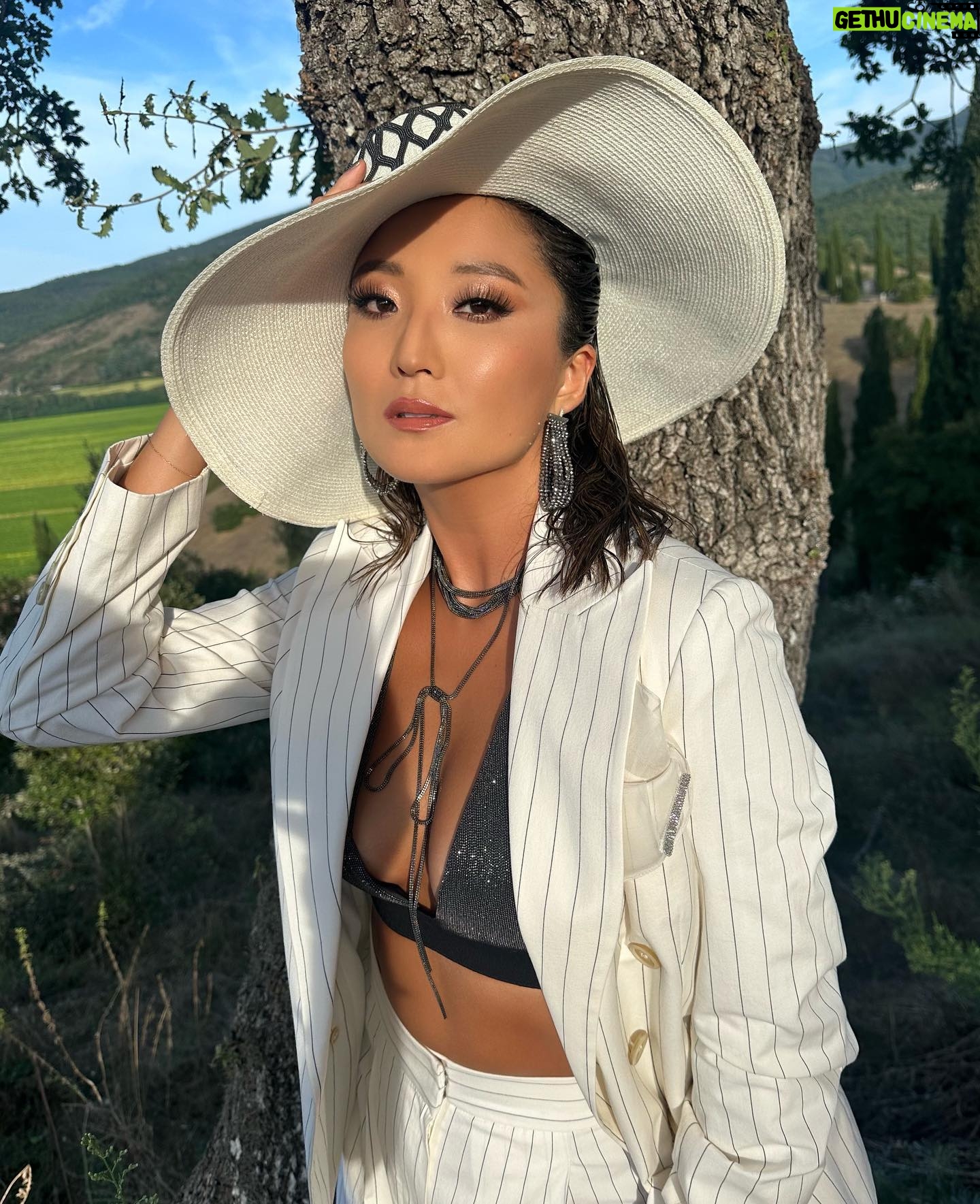 Ashley Park Instagram - 🕊️my first time in the italian countryside! the essence of this region and of the entire Cucinelli family takes my breath away. genuinely grateful to celebrate @brunellocucinelli birthday and legacy 🤍
