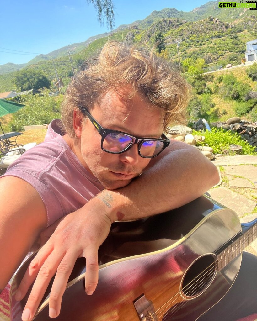Ashton Irwin Instagram - Prepare yourself, the following is a documentation of my current existence - the first two are just me chillin during my morning guitar ritual, wake up and play - bought a BBQ - here’s where it gets strange, I’m practicing my fire twirling skills and in my head I seem to think that’s what they do at Pomona beach/ Huntington Beach New Year’s Eve 😂 big things coming from this - “throwing ass” to prince on an FM radio in my house that I use for some reason now? It just feels good to listen too - hungover at pampas Brazilian food at the grove - getting massive beers with my bud @mrjmachanson - doing 100 sumo squats a day for the foreseeable future - with my green Gretsch shooting a video in the forest in Malibu at night time, creepy but cool Living La Vida Loca Ciao! X’s 💋