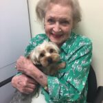 Betty White Instagram – It’s a rainy Monday in LA so here’s a sunny smile to brighten the day :). Any time we went to appointments or meetings, we tried to have a dog or cat available for Betty to love on.