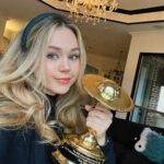 Brec Bassinger Instagram - It was in the midst of my brother and I opening all of the online gifts we had ordered… I open a box… I didn’t recognize what was inside… crap did I open one of his packages… “Beric did you buy me a trophy for Christmas?” I hear a scream in the other room. It’s my mom. ITS YOUR SATURN AWARD. Then I screamed. And now it sits proudly on our mantle. Thank you @saturnawards 💛⭐️ Xo.