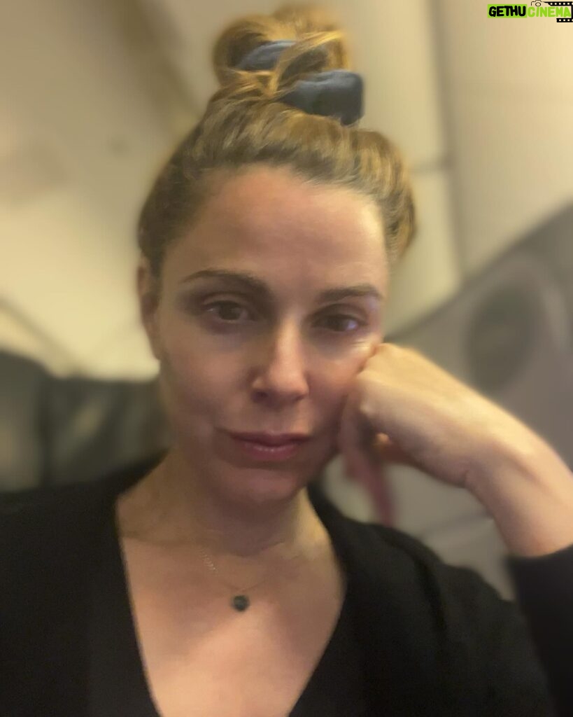 Cara Buono Instagram - Plane selfies. Been a while. Dark circles and top knot. #plane #travel #switzerland #zurich #instagood #basel #topknot #strangerthings