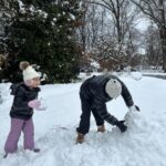 Caroline Manzo Instagram - Building a snowman with mommy @laurenmanzo - its a tiny snowman but she’s one happy little girl. ❤️❤️⛄️❄️