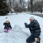 Caroline Manzo Instagram - Building a snowman with mommy @laurenmanzo - its a tiny snowman but she’s one happy little girl. ❤️❤️⛄️❄️