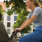 Caroline Wozniacki Instagram - Hey everyone! 🚴‍♀️ @carowozniacki here. Let's talk about getting around in Copenhagen. @davidlee and I had a blast testing a cargo bike, all thanks to my collaboration with @VisitCopenhagen! 👇 Did you know that Copenhagen has proudly been holding the title of the most bicycle-friendly capital since 2015? Pedaling through this city is not just a mode of transport but a way of life. Picture this: curb-separated bicycle tracks, charming bike bridges over the canals, dedicated cycle superhighways, and even traffic lights and green waves designed for two-wheeled commuters. Bikes outnumber cars, and here, taking your kids to school in a cargo bike is cooler than cruising in an SUV. And let's not forget about the iconic harbour busses were you can bring your bike and smoothly glide along the waterways. The stunning waterfront views make every ride an experience in itself. Stay tuned as I continue to explore Copenhagen's gems 👋❤️ #beautifuldestinations #instagood #igerscopenhagen #photography #featuremevisitcopenhagen #travel #visitcopenhagen #ibyen #copenhagen #denmark #cphpicks #sharingcph #delditkbh #wanderlust