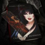 Cassandra Peterson Instagram - Who says you can’t judge a book by its cover? Especially when it looks this devilishly charming! 😈🖤 Curl up with a mug of something dark and Cassandra Peterson’s Best-Selling autobiography, ‘Yours Cruelly, Elvira’ … or if you’re more of a visual learner, Elvira’s Coffin Table Book! #elvira #elviramistressofthedark #cassandrapeterson #yourscruellyelvira #autobiography #bestsellers #bookstagram #books #coffeetablebooks #horror #halloween #halfwaytohalloween