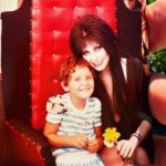 Cassandra Peterson Instagram - Check out this cute #flashback pic shared by @disneydebauchery 🖤 “I first fell in love with Elvira when I was super little, I use to watch the TV show religiously. This was before she did all the movies and stuff. One day my mom told me that she had a surprise for me, but she wanted to take me out and get my haircut first. I got the worst hair cut I have ever had in my life that day, even my Mom was upset. The surprise was Elvira was doing an Easter Bunny/Santa Claus style photo opportunity in our local grocery store parking lot and now I had to go see her with a stupid hair. I stood in that line and felt so embarrassed I almost cried but I was determined to meet her. All the people in line were horny teenaged boys so she was probably thrilled that this young nervous little girl was so excited to see her with flowers she clearly picked out of the flowerbeds in the parking lot. She was so fantastically sweet and amazing. I’ll never forget it.” #elviramistressofthedark #elvira #younggothgirlinthemaking #flashbackfriday