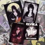 Cassandra Peterson Instagram - Got a favorite place you’d like the Mistress of the Dark to haunt? Grab some of our new spooky @therealelvira stickers and adorn your world with a touch of her dark charm! #elvira #elviramistressofthedark #elvirasbootique #elvirastickers #sticker #stickers #halloweenstickers #horrorstickers #bumpersticker #halloween