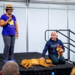 Cesar Millan Instagram - TCW Testimonial - Wendi Three years ago, I had Cesar’s TCW class listed on my bucket list…and now, I have been to three of his classes! Some people might think dogs go to the DPC to learn, but dogs are instinctual creatures, so it’s really the humans that are there to learn. It can be hard, even frustrating at times, to learn to stop habits that don’t serve you (like keeping tension on the leash), but remember that we don’t create habits overnight, so it can take time. If you’re open to growth, you can learn a lot about yourself from Cesar and the amazing trainers that partner with him. It takes a village to raise kids, and dogs, and Cesar’s village is truly phenomenal. ————— Hace tres años, tenía las clases de Training Cesar’a Way en mi lista de deseos... ¡y ahora he asistido a tres de sus clases! Algunas personas podrían pensar que los perros van al DPC para aprender, pero los perros son criaturas instintivas, por lo que en realidad son los humanos quienes están ahí para aprender. Puede ser difícil, incluso frustrante a veces, aprender a dejar hábitos que no te sirven (como mantener la tensión en la correa), pero recuerda que no creamos hábitos de la noche a la mañana, por lo que puede llevar tiempo. Si estás abierto al crecimiento, puedes aprender mucho sobre ti mismo de César y de los increíbles entrenadores que trabajan con él. Se necesita un pueblo para criar niños y perros, y el pueblo de César es realmente fenomenal. #betterhumansbetterplanet