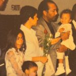 Chelsea Tavares Instagram - It’s been a month since My dad has passed. we were all nervous about posting it, because it makes it a bit more real , now that it’s public. A Post will never hold enough weight to let people know how much you impacted us and others around us. From our family, to friends, to neighbors, to the people that worked at your favorite donut shop. you were the person that loved and people called on. You were the Father to people that didn’t have a father . when our friends and ex’s fly out of state just to see you one more time before you go, you know you’re the shit. No matter what happened in life, you were always there. Always on time to pick us up from school, or the airport. You were the cook of the house. we were the house, where you knew my dad was gonna grill and make some bomb burgers or steak while mommy drank her white wine and cleaned. you quietly sized up all of me and my sisters dates.. You would leave Hershey chocolate bars on our pillows in the morning every valentine’s day. Even when mommy was mad, you grabbed her , kissed her, and would squeeze her butt until she laughed. when i think of GOOD CLASSIC music. like that bobby Caldwell , Phil collins, The Beatles, Debarge music. I think of you. The Police was our favorite band. we would play it driving down to San diego. we shared our love for vintage cars and black and white movies. you made me Look up all of the black actresses & singers that i didn’t know about from the 40’s and 50’s. Koden keeps asking for “pop pop”. it’s really hard to answer him. you said watching a movie and having a bowl of Vanilla ice cream with him , was you and koden’s “thing”. so I will continue to remind him of that. he had a bowl the other day ♥️ Currently wearing your T shirt and the bracelet you got me for my 30th. It’s so surreal. I wish I could hug you, i wish you would call me saying “i don’t want nothing, just want to tell you I love you.” There is always gonna be a hole in my heart. I wish you could have walked us down the aisle, but i believe we have too much character and personality for the spirit to just not be here any more. i can literally feel you around. we just miss you. that’s all. ♥️your “Chelsea Baby”