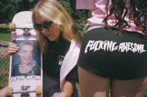 Chloë Sevigny Instagram - September 6th get your @fuckingawesome booty shorts, polos and more, designed by moi! For boys and girls and everyone in between. Classic class photo board with new pink glitter background too! 
🖤F🎀A🖤