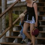 Chloë Sevigny Instagram - #fbf to holiday looks on a weekend getaway with @houseofwaris & @sabineheller hosted by @etereoauberge 📸 @brinkleycapriola Shirt vintage @jeanpaulgaultier acquired at Wasteland SF vintage @tomford shades belt needlepoint #dancingbears gift from @haleywollens trousers and bag @maisonmargiela rubber slippers @yproject_official