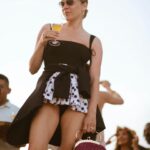 Chloë Sevigny Instagram - #fbf to holiday looks on a weekend getaway with @houseofwaris & @sabineheller hosted by @etereoauberge 📸 @brinkleycapriola Shirt vintage @jeanpaulgaultier acquired at Wasteland SF vintage @tomford shades belt needlepoint #dancingbears gift from @haleywollens trousers and bag @maisonmargiela rubber slippers @yproject_official
