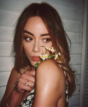 Chloe Bennet Instagram - it’s always nice to gently hug & bite things you love 

hair: @davestanwell 
make up: @kiranasrat 
& disposable camera work by @markvmode duh