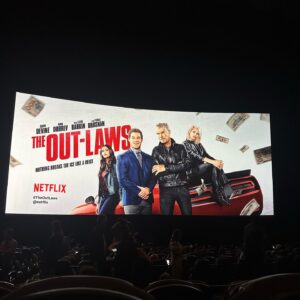 Chloe Bridges Instagram - Some pictures from the Out-laws premiere which is ON NETFLIX TODAY. This is a special one - adam started developing it in 2016, got incredible producing partners in @thatallencovert @adamsandler & happy madison, and then this incredible cast @nina @piercebrosnanofficial @michael_rooker @poornagraphy @comedianlilrel etc.. plus the New York Times said adam was finally funny and I know he’s been looking forward to that. Proud of you @adamdevine #theoutlaws @netflix