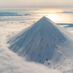 Chris Burkard Instagram - Stretching between the shores of Alaska and Russia, this chain of 14 volcanoes and 55 smaller land masses make up what is known as the Aleutian Islands… one of the most remote and difficult landscapes I’ve photographed - due to the harsh storms the frequent the Bering sea that often shrouds them in thick clouds & fog. In the past, I had set out to these islands with the goal of surfing in mind.. but in 2018, I received a grant from Conservation International to document the Alaska Maritime Wildlife Refuge - focusing more on showing the scope of the landscape and it’s largely undisturbed beauty. We caught a window in the weather - so I grabbed my camera & jumped in a small plane… resulting in some of the most unforgettable aerial views of my career.