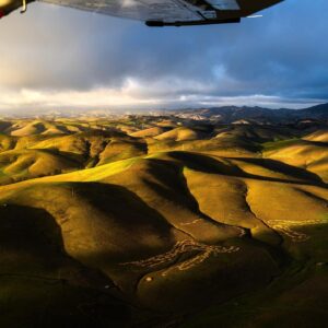 Chris Burkard Instagram - Over the last week, I’ve been filming First Take: Season 2 around my old stomping grounds here in California’s Central Coast... I felt like it’s important to show places that are sometimes overlooked for visiting, especially one that played such a huge part in my career back in the days when I lived in my truck and was borrowing telephoto lenses to shoot surf. Since aerial photography is a passion of mine, I decided to share that perspective with @rachel_jones_ross and we scored one of the best sunsets I’ve seen in years, serving as a reminder of how special & idyllic this little corner of the world can be.