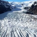 Chris Burkard Instagram - I’ve been dreaming up something big for the last few years.. trying to combine disciplines for a glacier crossing / pack rafting adventure leading me to Vatnajökull - the biggest glacier in Europe & one I’ve always dreamt of crossing but felt I would never have the skillset. I’ve poured myself into long training days - trying to get accustomed to Polar style expeditions….  Long story short - I’m heading off tomorrow to cross Vatnajökull glacier from West to East with a descent down a rarely traveled glacial tongue in east iceland: Lambatungnajökull, from there we’ll attempt to Packraft to the ocean. Shown above are clips of the route during a scouting flight last Friday to assess conditions.The dream is a source to sea expedition, glacier to ocean. My tracker link is in my bio and here: https://share.garmin.com/ChrisBurkard See you on the other side.. and if you’re in Höfn mid May, come find me or drop me off some gummies