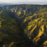 Chris Burkard Instagram – California’s Carrizo Plains & Cuyama Valley provide little access even with a good 4×4 vehicle for those hoping to photograph the surrounding ridges… while planning this particular assignment, we felt that flying in an Lightweight Aerial Trike and a Cessna seemed the best way to capture the dramatic effects of the super bloom in a way that gave genuine context to the landscape… something I value when putting together a body of work. 
Throughout my career, @natgeo has always been an incredible example of showcasing the earth and the important stories that it has to share… so this assignment to document California’s super bloom following significant winter rainfall in 2023 felt a little extra special being so close to my home.