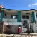 Chrissie Fit Instagram - While in Cuba, I visited the town where the Fit family was from, Guanabacoa. I met the few relatives we still have there, whom I’ve only ever spoken to through WhatsApp. They treated me with such love, kindness, and care. It was like I’d known them all my life. Thankfully, the woman who now lives in my family’s old home (pictured here) was happy to give us a tour inside. While the house has changed and deteriorated with time, I can still picture where my grandfather played dominos on the front porch and where the Christmas tree was set each year — in front of the three columns in the living room, now partially blocked by new stairs. I only cried like, five times. Picture Descriptions: 1 & 2. The Fit Family Home - Where my grandfather, grandmother, dad, uncle, great grandfather, great grandmother, great aunts, and great uncle lived (a total of 9 Fits!). 3. The living room 4. The back of the house 5. Some of my remaining family in Cuba 6. My uncle dressed as a ______ (any guesses?) and my grandfather (second from the right) with his friends 7. My dad when he was a baby in Guanabacoa 8. Cine Teatro Carral - The now abandoned movie theater where my grandfather watched what would become his favorite movie, King Kong 9. What was once the courthouse in Guanabacoa where my grandparents got married, now in ruins 10. My grandfather’s favorite niece, resembling my grandfather #Cuba #ReturnToMyRoots #CubanHeritage #Guanabacoa #FamilyHistory #FamilyHome #Family