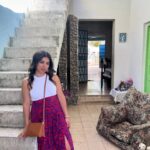 Chrissie Fit Instagram - While in Cuba, I visited the town where the Fit family was from, Guanabacoa. I met the few relatives we still have there, whom I’ve only ever spoken to through WhatsApp. They treated me with such love, kindness, and care. It was like I’d known them all my life. Thankfully, the woman who now lives in my family’s old home (pictured here) was happy to give us a tour inside. While the house has changed and deteriorated with time, I can still picture where my grandfather played dominos on the front porch and where the Christmas tree was set each year — in front of the three columns in the living room, now partially blocked by new stairs. I only cried like, five times. Picture Descriptions: 1 & 2. The Fit Family Home - Where my grandfather, grandmother, dad, uncle, great grandfather, great grandmother, great aunts, and great uncle lived (a total of 9 Fits!). 3. The living room 4. The back of the house 5. Some of my remaining family in Cuba 6. My uncle dressed as a ______ (any guesses?) and my grandfather (second from the right) with his friends 7. My dad when he was a baby in Guanabacoa 8. Cine Teatro Carral - The now abandoned movie theater where my grandfather watched what would become his favorite movie, King Kong 9. What was once the courthouse in Guanabacoa where my grandparents got married, now in ruins 10. My grandfather’s favorite niece, resembling my grandfather #Cuba #ReturnToMyRoots #CubanHeritage #Guanabacoa #FamilyHistory #FamilyHome #Family