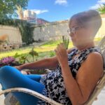 Chrissie Fit Instagram - While in Cuba, I visited the town where the Fit family was from, Guanabacoa. I met the few relatives we still have there, whom I’ve only ever spoken to through WhatsApp. They treated me with such love, kindness, and care. It was like I’d known them all my life. Thankfully, the woman who now lives in my family’s old home (pictured here) was happy to give us a tour inside. While the house has changed and deteriorated with time, I can still picture where my grandfather played dominos on the front porch and where the Christmas tree was set each year — in front of the three columns in the living room, now partially blocked by new stairs. I only cried like, five times. Picture Descriptions: 1 & 2. The Fit Family Home - Where my grandfather, grandmother, dad, uncle, great grandfather, great grandmother, great aunts, and great uncle lived (a total of 9 Fits!). 3. The living room 4. The back of the house 5. Some of my remaining family in Cuba 6. My uncle dressed as a ______ (any guesses?) and my grandfather (second from the right) with his friends 7. My dad when he was a baby in Guanabacoa 8. Cine Teatro Carral - The now abandoned movie theater where my grandfather watched what would become his favorite movie, King Kong 9. What was once the courthouse in Guanabacoa where my grandparents got married, now in ruins 10. My grandfather’s favorite niece, resembling my grandfather #Cuba #ReturnToMyRoots #CubanHeritage #Guanabacoa #FamilyHistory #FamilyHome #Family