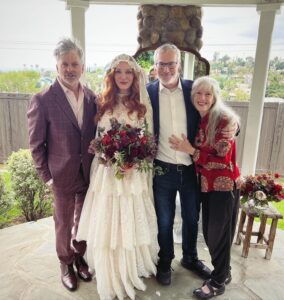 Christina Hendricks Instagram - My mother has Alzheimer’s and was not able to come to New Orleans for our wedding, so we brought the wedding to her yesterday in our backyard. My mother has always been my best friend and there was no way we weren’t going to share our love and celebrate with the biggest supporter and cheerleader in my life. When you are living so in the moment, so in the present, it is so important to have beauty and love and happiness around you. This time we had flower girls and dogs and more wonderful friends join us. @garbage surprised us with a Scottish wedding twist to this ceremony and it was another perfect day. @gillyflowersla made beautiful arrangements inspired by our New Orleans wedding and who wouldn’t want to wear their wedding dress twice!!! @katyakatyalondon @clairepettibone #alzheimers