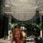 Christina Hendricks Instagram - Ahhhh New Orleans. How I love you! And my first stay at @fourseasons was dreamy. Like having a cocktail under crystal rain and the spa was pure heaven. Always love this city even in 105 degree weather. Pure romance. Oh and the John Alexander paintings!!!!! #fourseasons #neworleans #nola #hatgirl #hatattack #yetanotherhat