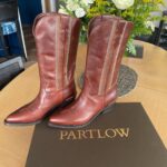 Christina Hendricks Instagram – This is sooooo exciting. @lawrensample and @kaseylemkin of @partlowofficial released their gorgeous new boot line last week and wait for it……. They named this one the “Christina Boot”!!! I’m so honored! She’s a gorgeous boot that is traditional with a twist. C’est moi! @popsugar is already talking about the Christina boot. She’s gonna be iconic. 💋 #partlow #cowboyboot #classicboot #christinaboot