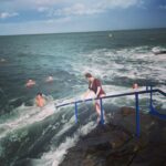 Christina Hendricks Instagram - Those of you who know me well, know I have a fear of the ocean. But bigger than that fear, is the fear of not doing something extraordinary because I’m too scared. So, I decided I would go to the 40 ft. In Dublin and jump into the Irish Sea. But before I could take my own steps, the ocean, in one dramatic wave , grabbed me from this rock and through me under, scraping my leg, plunging me under water with a mouth full of salt water as I was gasping for breath and then pummeling me over and over again with waves that made it almost impossible to swim back to land. But I did it. And it was exhilarating. I survived. And I might even do it again. But better planning next time…. I’m proud of myself. #40ft #dublin #irishsea