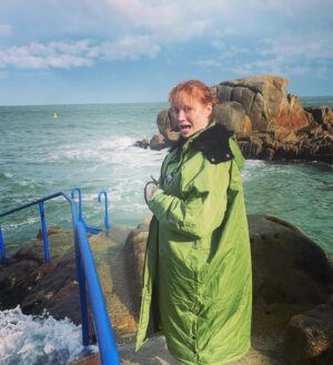 Christina Hendricks Instagram - Those of you who know me well, know I have a fear of the ocean. But bigger than that fear, is the fear of not doing something extraordinary because I’m too scared. So, I decided I would go to the 40 ft. In Dublin and jump into the Irish Sea. But before I could take my own steps, the ocean, in one dramatic wave , grabbed me from this rock and through me under, scraping my leg, plunging me under water with a mouth full of salt water as I was gasping for breath and then pummeling me over and over again with waves that made it almost impossible to swim back to land. But I did it. And it was exhilarating. I survived. And I might even do it again. But better planning next time…. I’m proud of myself. #40ft #dublin #irishsea
