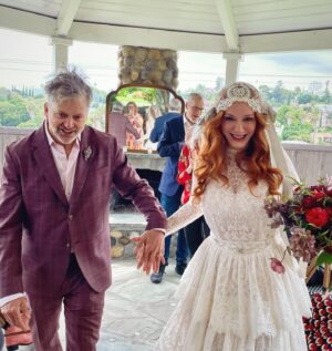Christina Hendricks Instagram - My mother has Alzheimer’s and was not able to come to New Orleans for our wedding, so we brought the wedding to her yesterday in our backyard. My mother has always been my best friend and there was no way we weren’t going to share our love and celebrate with the biggest supporter and cheerleader in my life. When you are living so in the moment, so in the present, it is so important to have beauty and love and happiness around you. This time we had flower girls and dogs and more wonderful friends join us. @garbage surprised us with a Scottish wedding twist to this ceremony and it was another perfect day. @gillyflowersla made beautiful arrangements inspired by our New Orleans wedding and who wouldn’t want to wear their wedding dress twice!!! @katyakatyalondon @clairepettibone #alzheimers