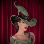 Christine McConnell Instagram - A hand crafted Witch’s Hat 🎄🐸🎄 I was inspired by the amazing hat @lordxblackwood made for me in 2019 and decided to have a go at making my own 🎉 It was built using window screening as the base. I then hand sculpted “Pancake” the Frog, as well as the buckle ✨ Full episodes are on Patreon 🪄