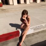 Ciara Bravo Instagram - For the April 2021 issue of @BritishVogue. Make this make sense. I’m still reeling Photographed by @GregWilliamsPhotography Styled by @DenaGia and portfolio edited by @GilesHattersley Clothing: @Prada Shoes: @CasadeiOfficial Earrings: @VanCleefArpels Hair by @JennyChoHair Makeup by @FionaStiles With thanks to @EbellEvents and entertainment director-at-large @JillDemling