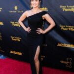 Danica McKellar Instagram – Oh hi, red carpet – it had been a minute! 🥰 What an incredible night – a beautiful red carpet and a @movieguide awards ceremony I was honored to co-host alongside @trevordonovan amidst our @greatamericanfamily ! Here’s the lowdown on the pics:
.
.
1. Red carpet shot
2. Another red carpet shot 😅
3. Red carpet with my amazing husband!
4. Selfie w/@candacecbure 💕
5. Group shot with many actors and executives of @greatamericanfamily – including our CEO @billabbotthc! 🤗
6. Stepping onstage to host with @trevordonovan 
7. Trevor was so much fun to host with!
8. Backstage shot with @MovieGuide owner @tedbaehr and legend @dennisquaid – who performed some awesome tunes! 🤗
9. Post-show laughs with my dear friend Lori Loughlin. 💕
.
.
I hope you’ll join us one week from tonight – March 7th at 8pmET on @greatamericanfamily! 🍿🎬❤️