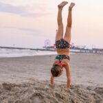 Danielle Busby Instagram - Just gotta love how my girls take after their Mama #me ☺️ and have a love of doing handstands everywhere we go ! #handstand #itsabuzzworld #outdaughtered