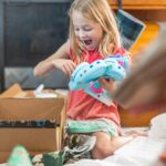 Danielle Busby Instagram - Scrolling through pics and can’t help but smile at Riley. Her excitement opening up every gift was priceless…even opening up her pair of crocs she picked out 🤣 #christmas #itsabuzzworld #outdaughtered