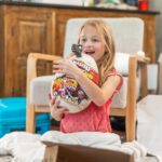 Danielle Busby Instagram - Scrolling through pics and can’t help but smile at Riley. Her excitement opening up every gift was priceless…even opening up her pair of crocs she picked out 🤣 #christmas #itsabuzzworld #outdaughtered