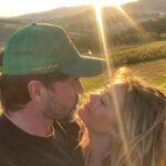 Denise Richards Instagram - It’s been a dream of mine & my husband’s to go to Tuscany. I was so lucky to shoot in Italy this past week so we decided to make a big trip out of it. Here we are Trying to capture the best pic & me looking ridiculous and my hair all crazy( we just went to the spa) I look at some of your photos and wonder who the hell is there to take them? Do you all travel with someone? Do you ask someone close by to shoot it? I’m so curious 😂 because most of you all that I follow your vacay pics looks really good!