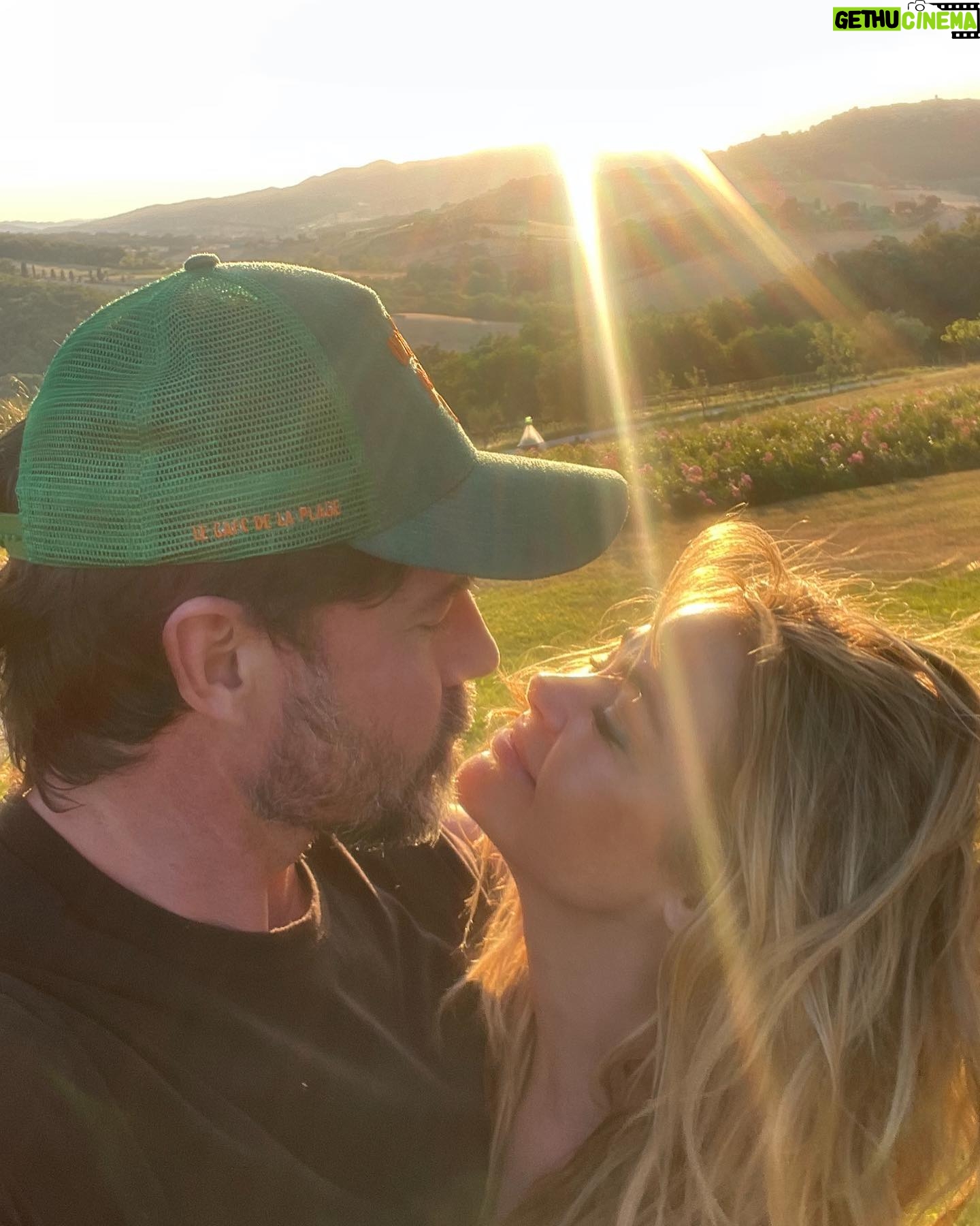 Denise Richards Instagram - It’s been a dream of mine & my husband’s to go to Tuscany. I was so lucky to shoot in Italy this past week so we decided to make a big trip out of it. Here we are Trying to capture the best pic & me looking ridiculous and my hair all crazy( we just went to the spa) I look at some of your photos and wonder who the hell is there to take them? Do you all travel with someone? Do you ask someone close by to shoot it? I’m so curious 😂 because most of you all that I follow your vacay pics looks really good!