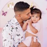 Dhar Mann Instagram - Happy 1st birthday to my beautiful girl @ella.rose! I can’t believe how quickly you’re growing up. I get sad thinking about how you won’t be holding my hand forever, but then I feel better knowing that at least you’ll always be holding my heart 💗 Please know that your mommy and daddy love you so much! No matter what you decide to do in life we will always support you and be so proud of you baby girl. You’re the greatest blessing @laurag_143 and I could’ve ever prayed for🙏🏽👶🏻 - P.S. if you want to see her 1st birthday party vlog the link is in my bio!