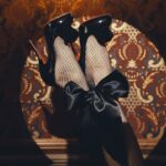 Dita Von Teese Instagram - On #InternationalGinDay @sweetgwendolinefrenchgin raises a glass to the spirit of #JohnWillie ‘s #BizarreMagazine and the art of playful, glamorously risqué power play… bottoms up! ✨🍸⛓🫦✨ #SweetGwendoline #Frenchgin can be delivered directly to your door. 🎥 🎬 @toscacyr and @studiobowman and filmed at one of our favorite Hollywood bars, @novacancyla #fetish #ditavonteese #Glamonatrix #girlintheglass #burlesque #tomoffinland #bettiepage #irvingklaw #fetishqueen #fullyfashionedstocking #bondage #hautefetish #dita