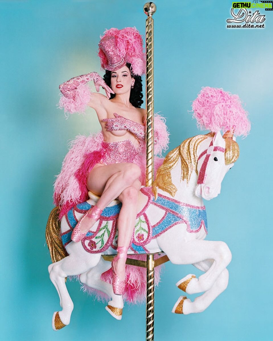 Dita Von Teese Instagram - The Carousel Horse ✨🎠✨ When @catherinedlish and I first debuted this act in 2001, as the new wave of burlesque was underway, it blew expectations among audiences and fellow entertainers. The top hat. The costume. The #carousel horse complete with shiny brass pole. Everything blindingly and colorfully twinkled with @swarovski ✨ Catherine’s costume was the most over the top she had done at the time. In my 2002 #Playboy cover story, I posed in my full “Carousel” act regalia, from plume to #pointe shoes, perched atop the twee horse. Alas, that #bedazzled beast went missing a few years later and we had to remake it. For Dita Las Vegas, three of the four jeweled horses now in my “stable” appear, side straddled by Von Teese Dancers in Jubilee archival costumes. 🌟Dita Las Vegas has added even more shows! 🌟 March 27, 28, 29, 30 April 3, 4, 5, 6 April 10, 11, 12, 13 April 17, 18, 19, 20 April 24, 25, 26, 27 May 16, 17, 18 May 21, 23, 24, 25 May 29, 30, 31, June 1 June 5, 6, 7, 8 June 12, 13, 14, 15 Ticketmaster.com/ditavegas