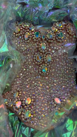 Dita Von Teese Instagram - A closer look at one of identical corsets made by @catherinedlish for @TaylorSwift and I wore for the #bejeweled video in my #giantmartiniglasses ✨🍸🍸✨

*If you think that’s something, wait til you get a load of the copious amounts of #Swarovski crystal on the #Glamonatrix tour!