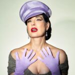 Dita Von Teese Instagram – English translation of 
‘FEMME DE TÊTE’:
Assertive woman.

Soft but unyielding, this satin officers cap was inspired from @ditavonteese ‘s fetish modeling days, with a candy colored twist. (Obviously available in Black as well, we haven’t gone completely mad.) 

@ditavonteese by @travis_shinn 
Dresses:
@maguydechadirac 
@lenahoschek 
@jennypackham 
Jewlery:
@sillamjewelry 

#hoodxdita #travisshinn #ditavonteese #hoodlondon #millinery #vintagestyle #glamour