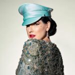 Dita Von Teese Instagram – English translation of 
‘FEMME DE TÊTE’:
Assertive woman.

Soft but unyielding, this satin officers cap was inspired from @ditavonteese ‘s fetish modeling days, with a candy colored twist. (Obviously available in Black as well, we haven’t gone completely mad.) 

@ditavonteese by @travis_shinn 
Dresses:
@maguydechadirac 
@lenahoschek 
@jennypackham 
Jewlery:
@sillamjewelry 

#hoodxdita #travisshinn #ditavonteese #hoodlondon #millinery #vintagestyle #glamour