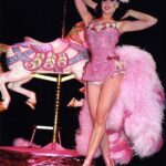 Dita Von Teese Instagram – The Carousel Horse ✨🎠✨
When @catherinedlish and I first debuted this act in 2001, as the new wave of burlesque was underway, it blew expectations among audiences and fellow entertainers. The top hat. The costume. The #carousel horse complete with shiny brass pole. Everything blindingly and colorfully twinkled with @swarovski ✨
Catherine’s costume was the most over the top she had done at the time. In my 2002 #Playboy cover story, I posed in my full “Carousel” act regalia, from plume to #pointe shoes, perched atop the twee horse. Alas, that #bedazzled beast went missing a few years later and we had to remake it. 
For Dita Las Vegas, three of the four jeweled horses now in my “stable” appear, side straddled by Von Teese Dancers in Jubilee archival costumes. 
🌟Dita Las Vegas has added even more shows! 🌟
March 27, 28, 29, 30
April 3, 4, 5, 6
April 10, 11, 12, 13
April 17, 18, 19, 20
April 24, 25, 26, 27
May 16, 17, 18
May 21, 23, 24, 25
May 29, 30, 31, June 1
June 5, 6, 7, 8
June 12, 13, 14, 15
Ticketmaster.com/ditavegas