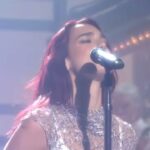 Dua Lipa Instagram - what an unbelievable week to have been a part of and to have witnessed the magic behind Saturday Night Live!!! An experience unlike any other. So grateful for all the trust to have me host and perform. Thank you Lorne for making my dreams come true. Thank you to the incredible cast and all the writers. I've had the most incredible time getting to work with you this week and just laugh my head off non stop. Thank you Steve, Brian, Rebecca and Sam for taking care of me daily and checking in throughout. Thank you Donna for holding my hand (literally) and running me up and down studio 8H making sure I get into all my costumes and wigs in time. Thank you Wally for teaching me the magical skill of cue cards. Thank you Gena for being my set godmutha and making sure everything runs smoothly and for being so lovely and encouraging throughout this week!! Thank you Mary-Ellen who just takes the best pictures... I love being infront of your lense. I feel like the luckiest girl in the world. Thank you to my team who make this all happen. Kathy we dreamed this up a long time ago and its been our wish come true!! My band and dancers, Peter, William, Charm, Sharon on creative direction and musical direction and choreo, my ride or dies... My dad, Sofia, Olivia, Maisy, Rae and my glam fam who made me feel like a million dollars Jahleel, Amir, Peter, Katie and Mei A MILLION THANK YOUUUUS! my family and best friends who flew in to be with me last night!!!! THANK YOU SNL FOR HAVING ME IN YOUR ORBIT!!!!! @nbcsnl !!!!! (Watch it all in full on youtubeeeee)