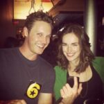 Elizabeth Henstridge Instagram - We met 10 years ago today 🤍 on the pilot tv show where we met {WE’RE JUST FRIENDS 🙊} // proposal 💁🏻‍♀️ // wedding ✨ // into the sunset…. // you caring for me while I’m siiiick sick sick instead of us being in Paris celebrating our anniversary 😬 {I have made this photo black and white for your protection friends 😵‍💫} Love you more and more @zacharyburrabel